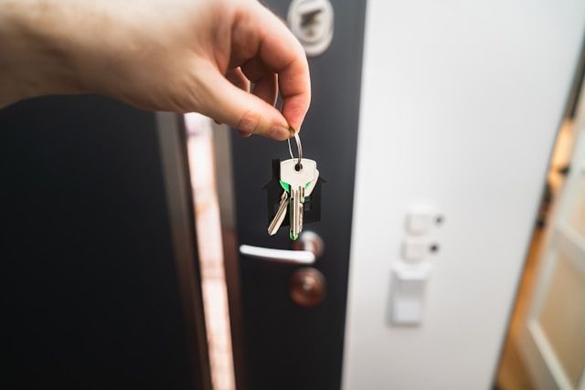 Keys lying in a person's hands.